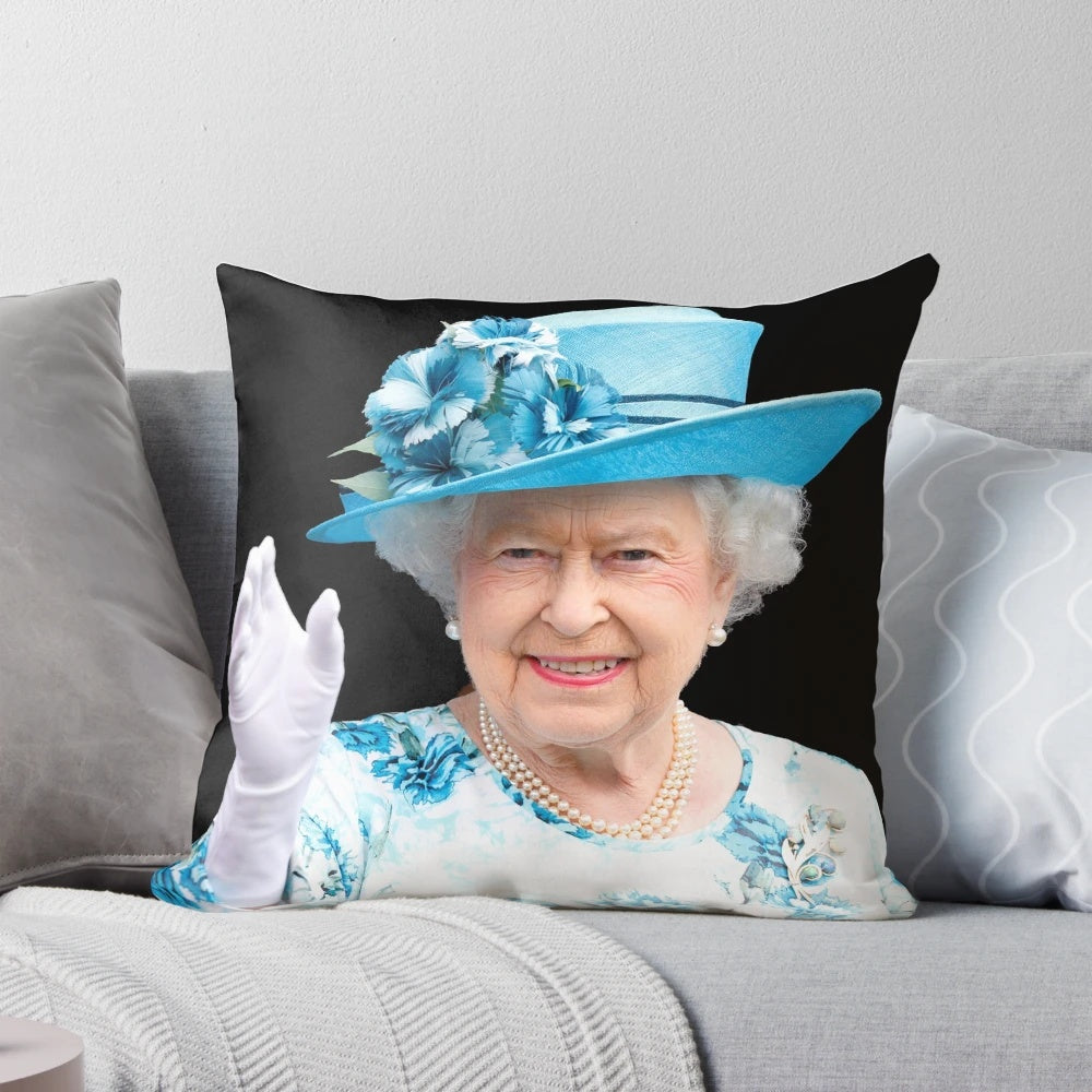 A decorative pillow featuring a portrait of Queen Elizabeth II.