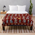 Plush blanket featuring illustrations of British monarchs throughout history
