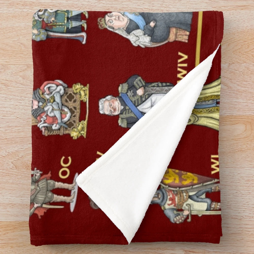 Plush blanket featuring illustrations of British monarchs throughout history