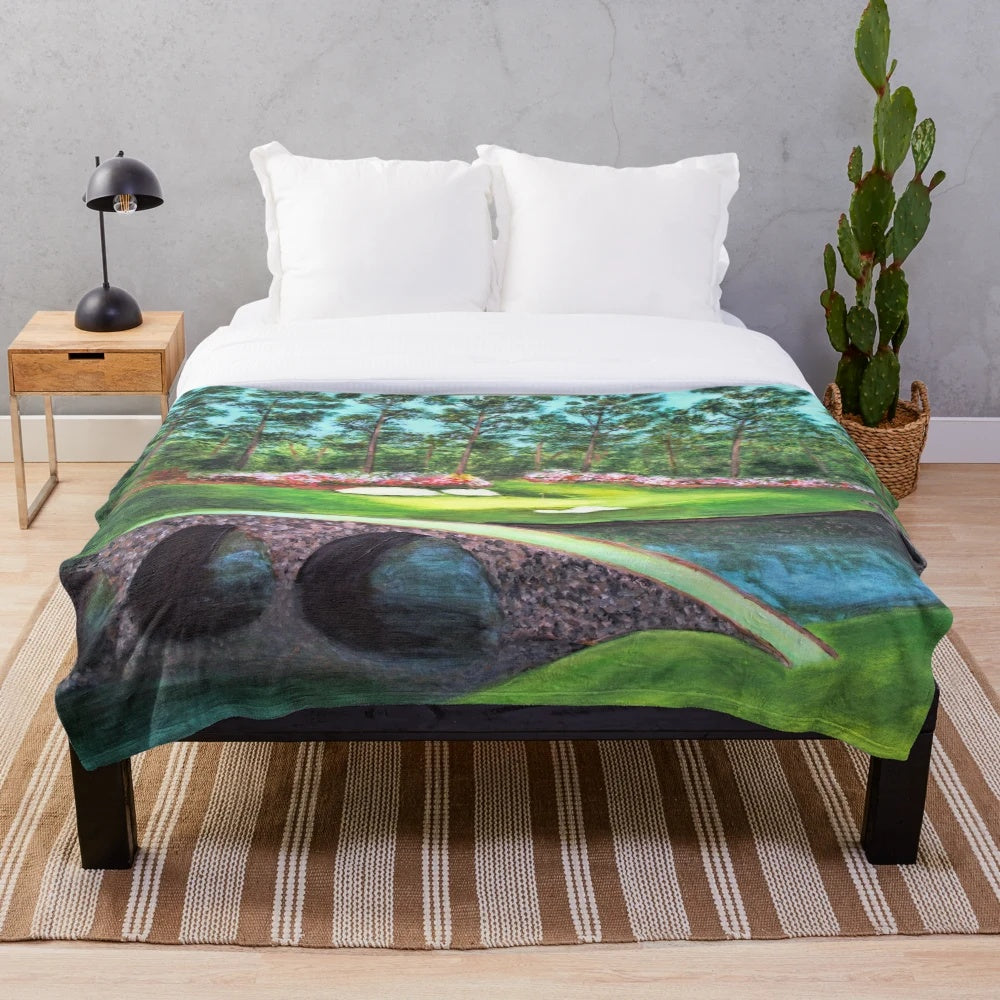 Plush blanket depicting the iconic 12th hole at Augusta National Golf Club