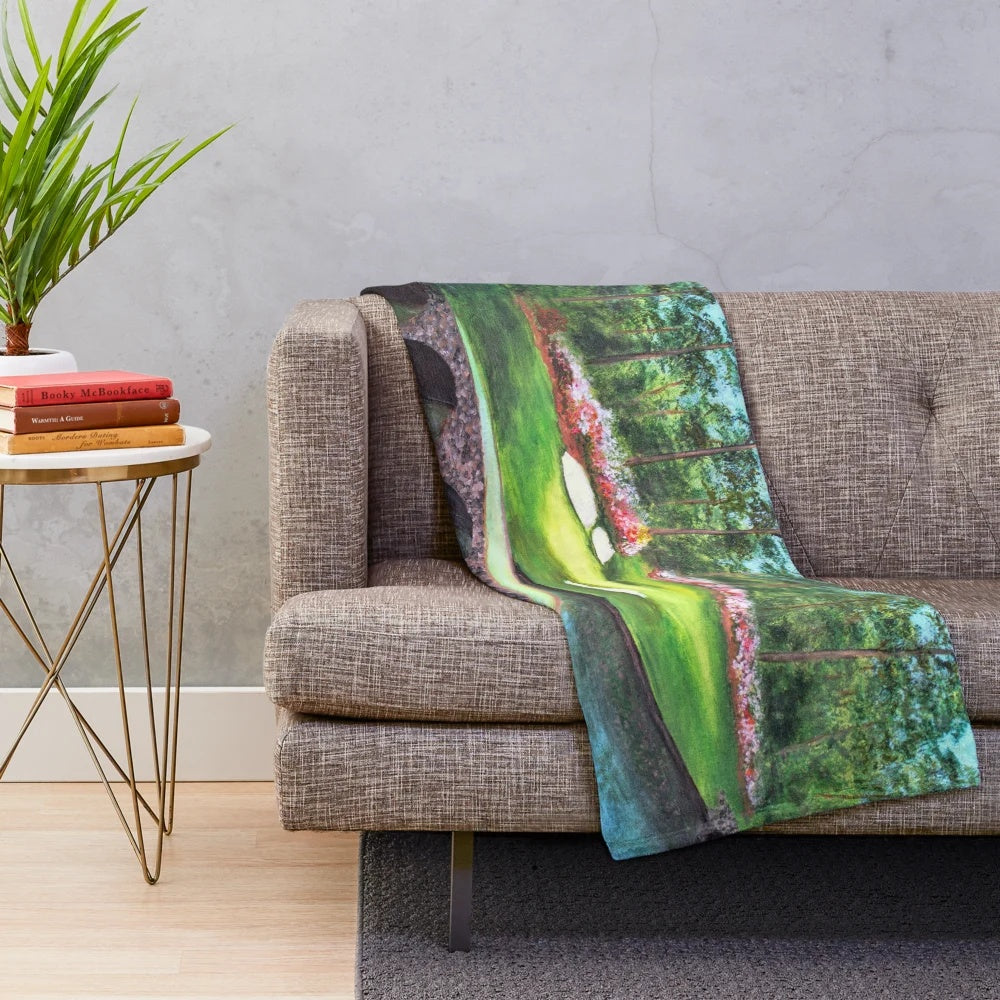 Plush blanket depicting the iconic 12th hole at Augusta National Golf Club