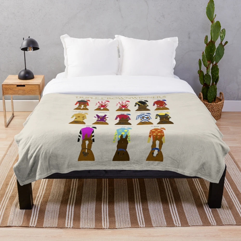 Plush blanket featuring the champion racehorses that won the prestigious Triple Crown