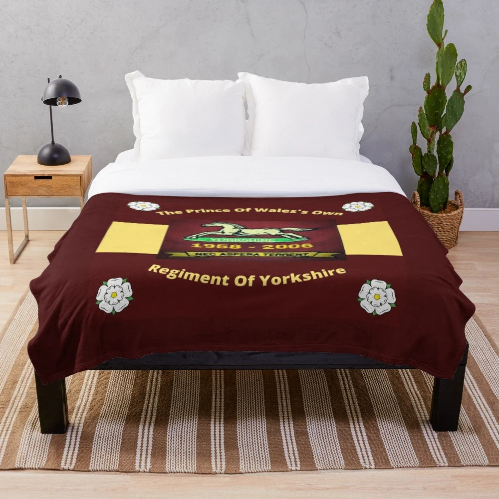 Plush blanket featuring the crest and colors of the Prince of Wales's Own Regiment of Yorkshire