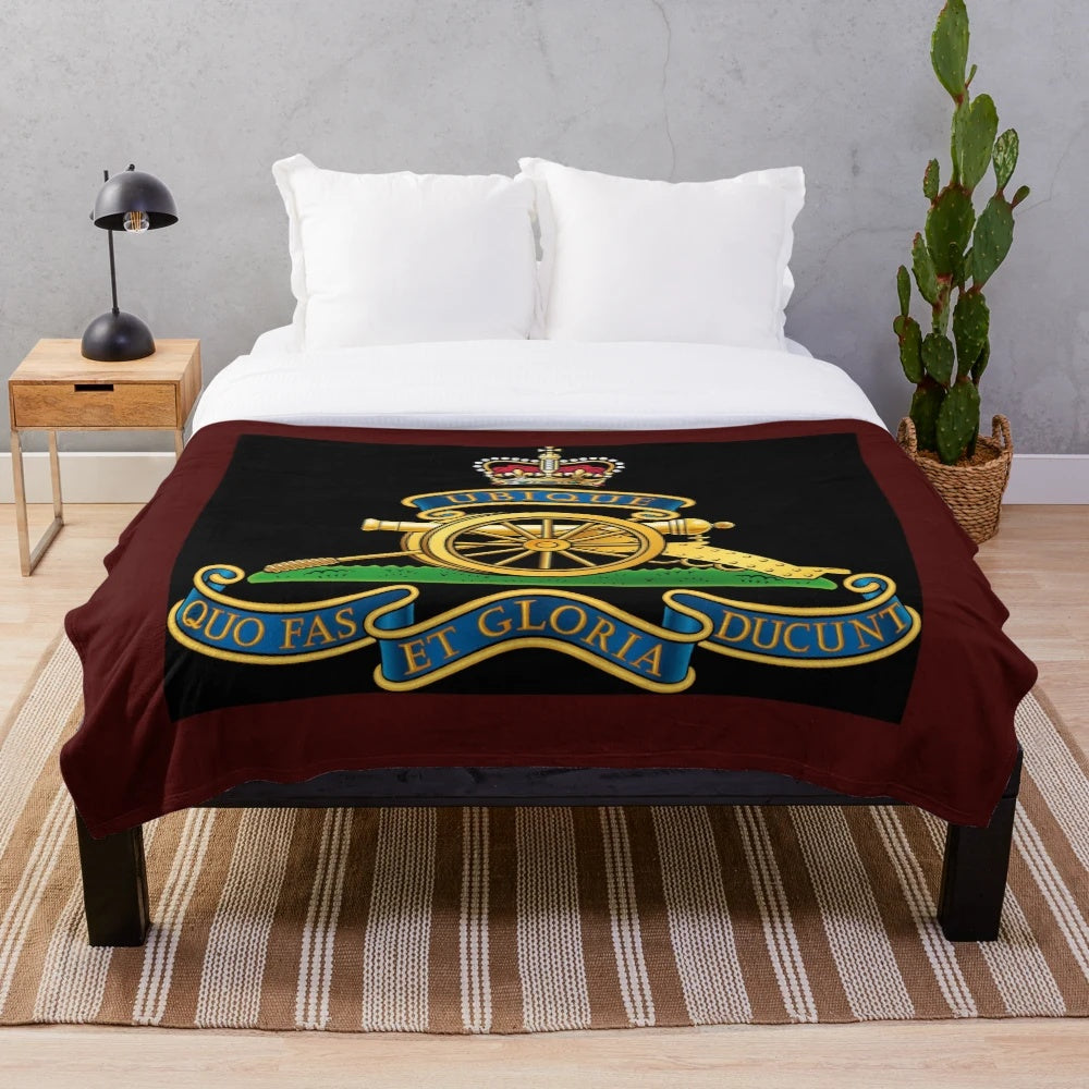 Royal Artillery cap badge design on a soft, plush blanket