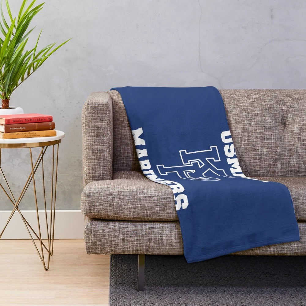 USMMA Mariners Plush Blanket featuring the school's logo and colors