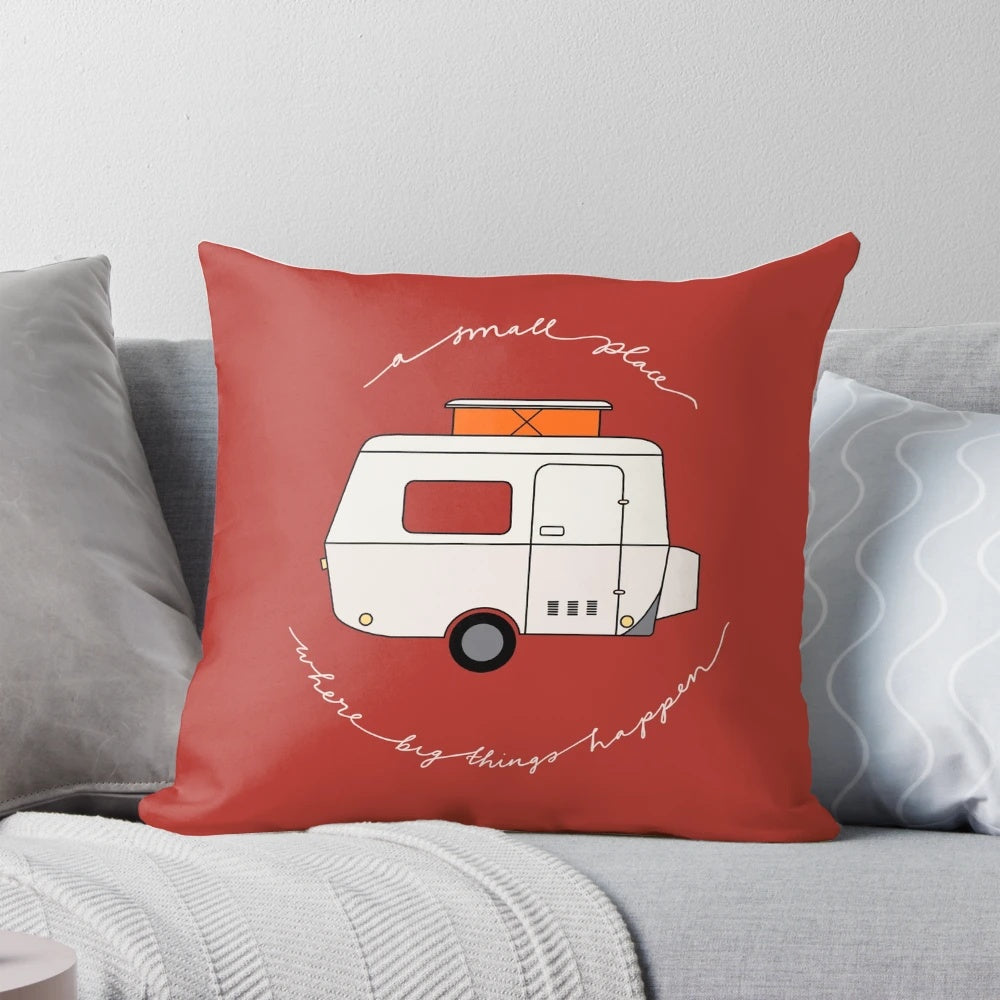 A red pillow with the text "A Small Place Where Big Things Happen
