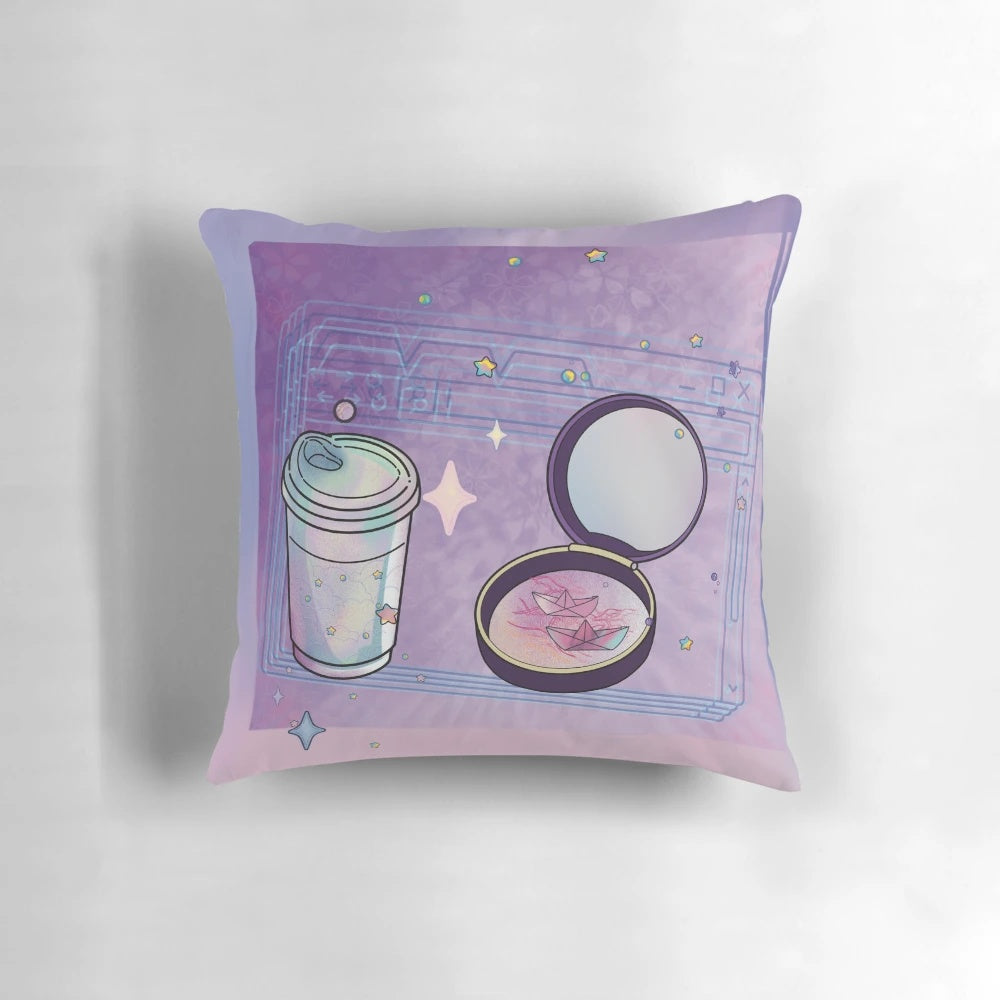 Closeup of a compact, glittery coffee-colored pillow with a mirror and stars design