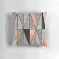A stylish concrete and copper pillow with a geometric triangle pattern, perfect for modern home decor.