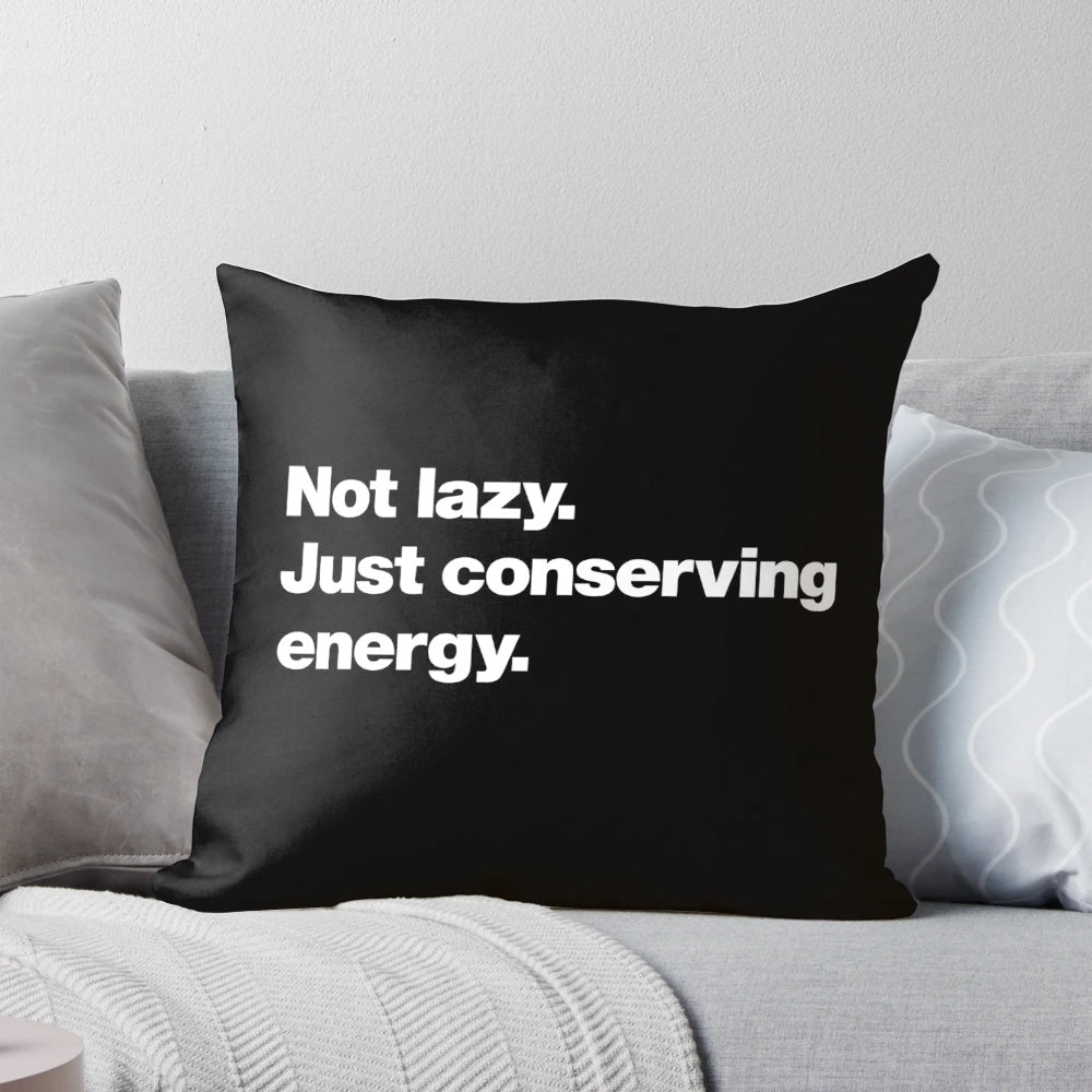 Not Lazy, Just Conserving Energy" pillow, featuring a humorous and witty design