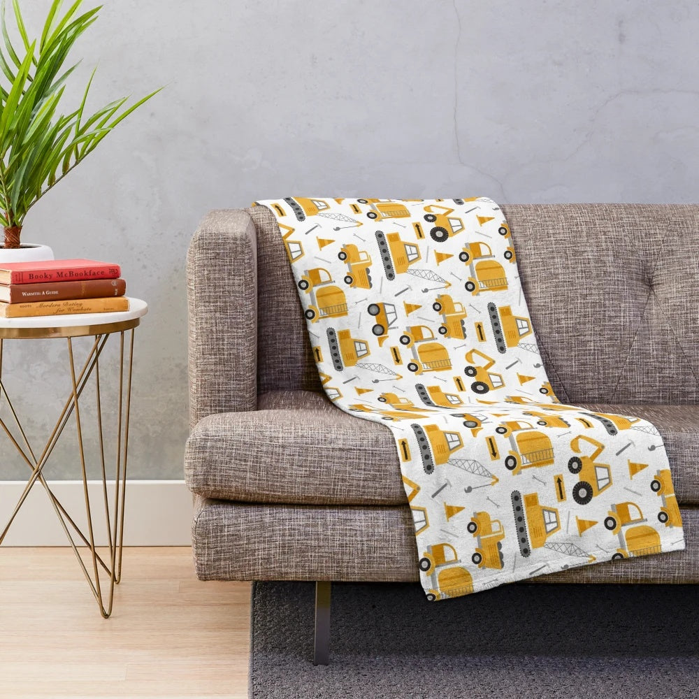 Construction trucks plush blanket with excavators, dump trucks, and cranes