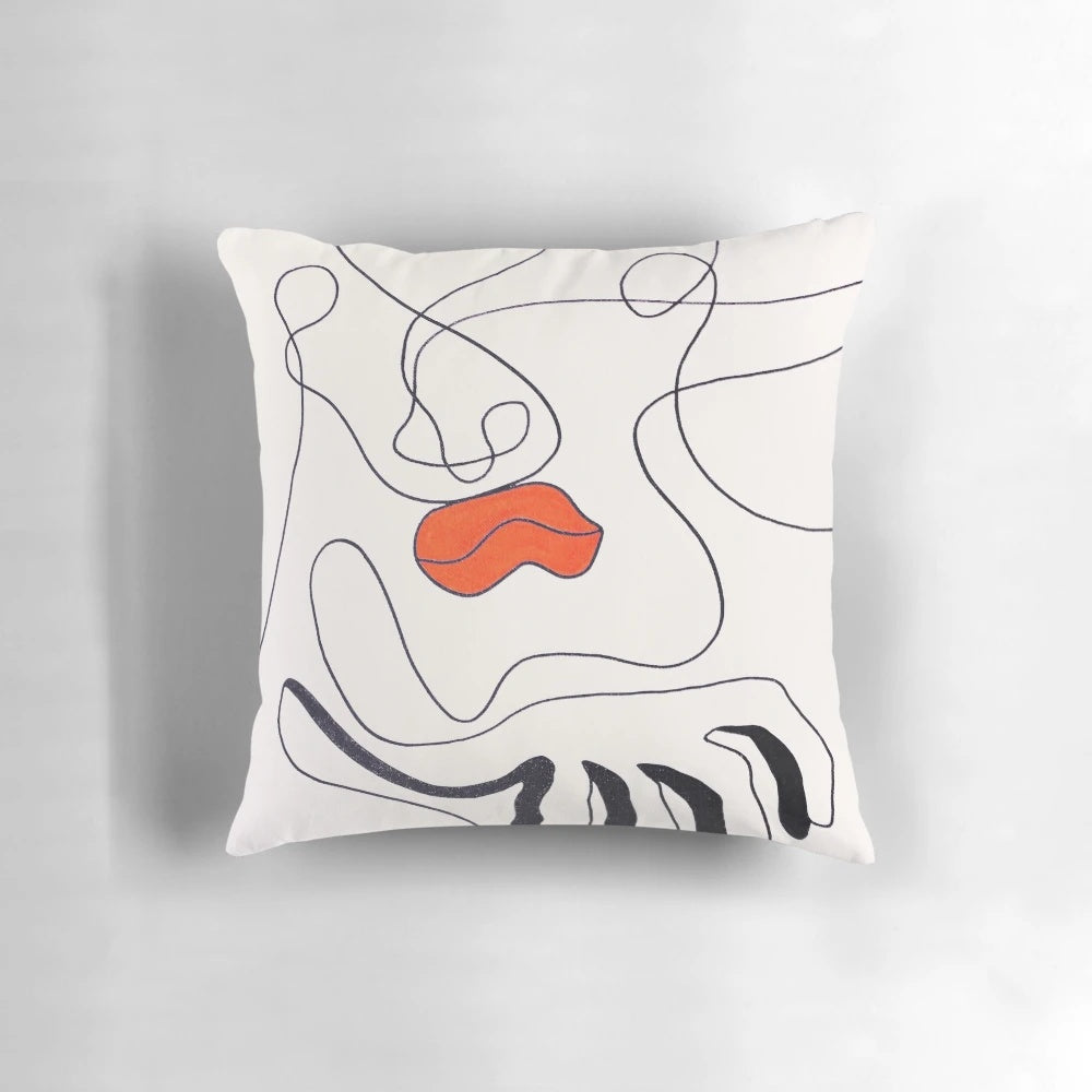 A bold, surreal contemporary art pillow featuring abstract lip design