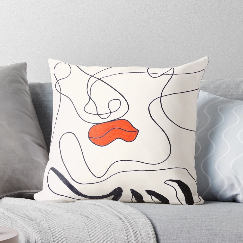 A bold, surreal contemporary art pillow featuring abstract lip design
