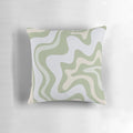 Vibrant contemporary abstract pattern in soothing sage green and grey almond colors on a decorative pillow