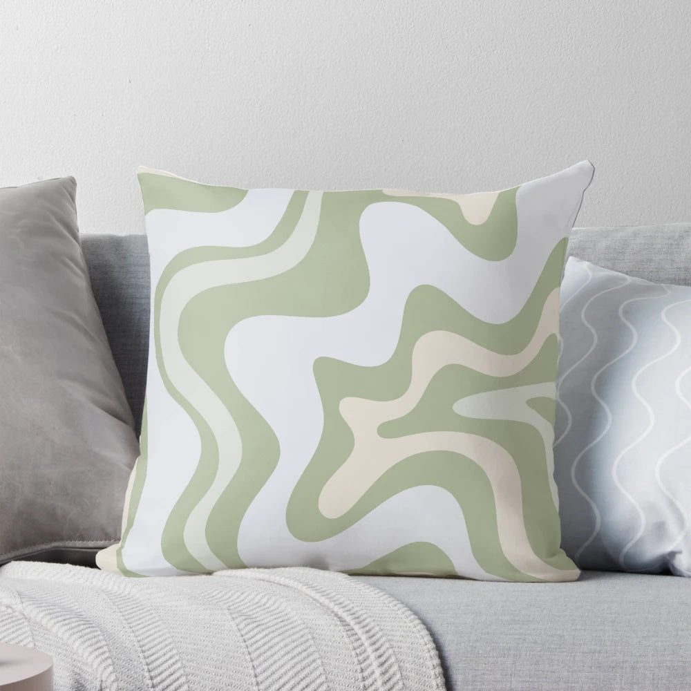 Vibrant contemporary abstract pattern in soothing sage green and grey almond colors on a decorative pillow