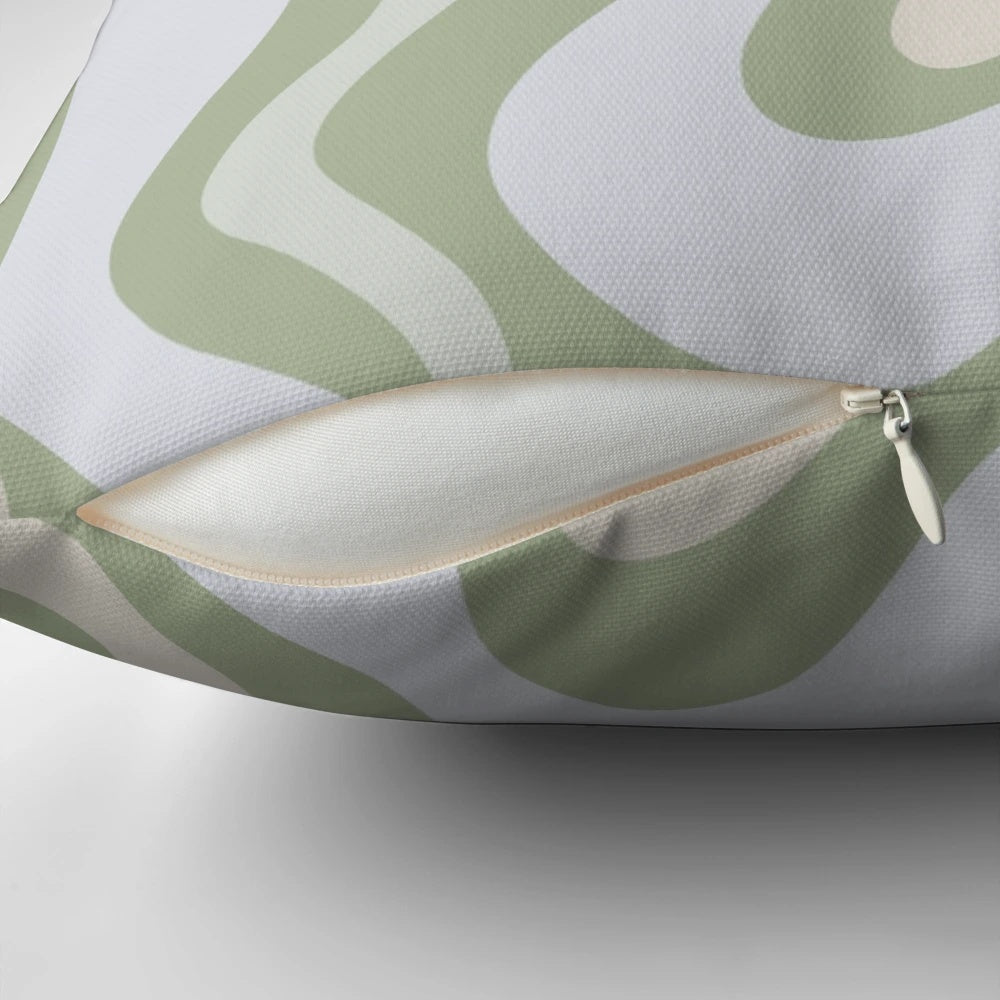 Vibrant contemporary abstract pattern in soothing sage green and grey almond colors on a decorative pillow
