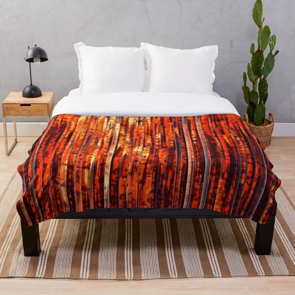 Contemporary abstract striped plush blanket with bold orange, yellow, and red colors