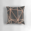 Black and copper geometric throw pillow with a modern, minimalist design