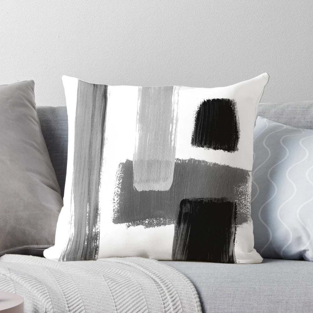 Black and white abstract geometric throw pillow with minimalist modern art design