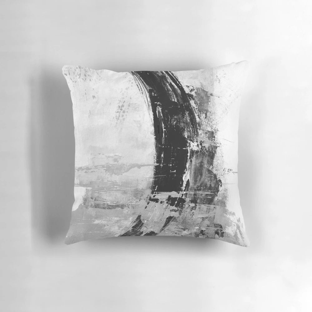 Gray abstract pillow featuring a modern, minimalist black and white painting design