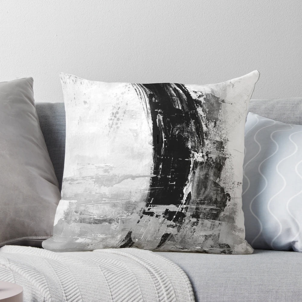 Gray abstract pillow featuring a modern, minimalist black and white painting design