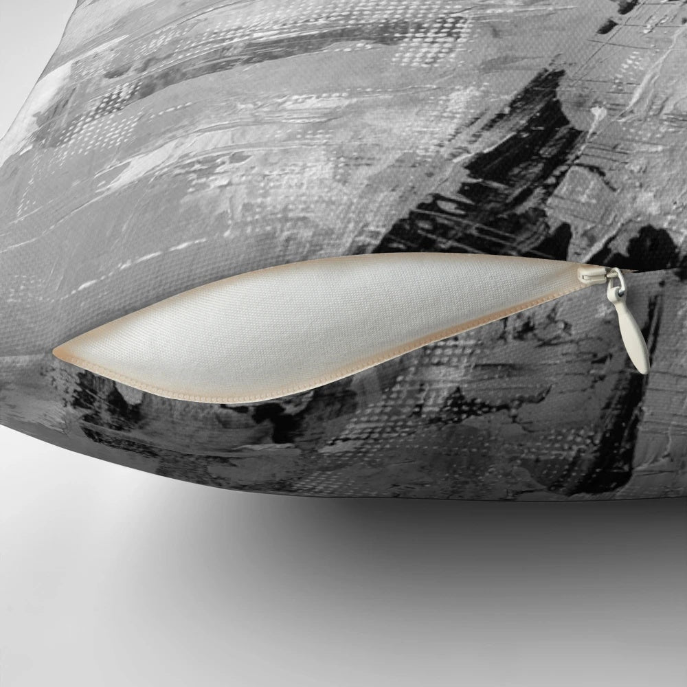 Gray abstract pillow featuring a modern, minimalist black and white painting design