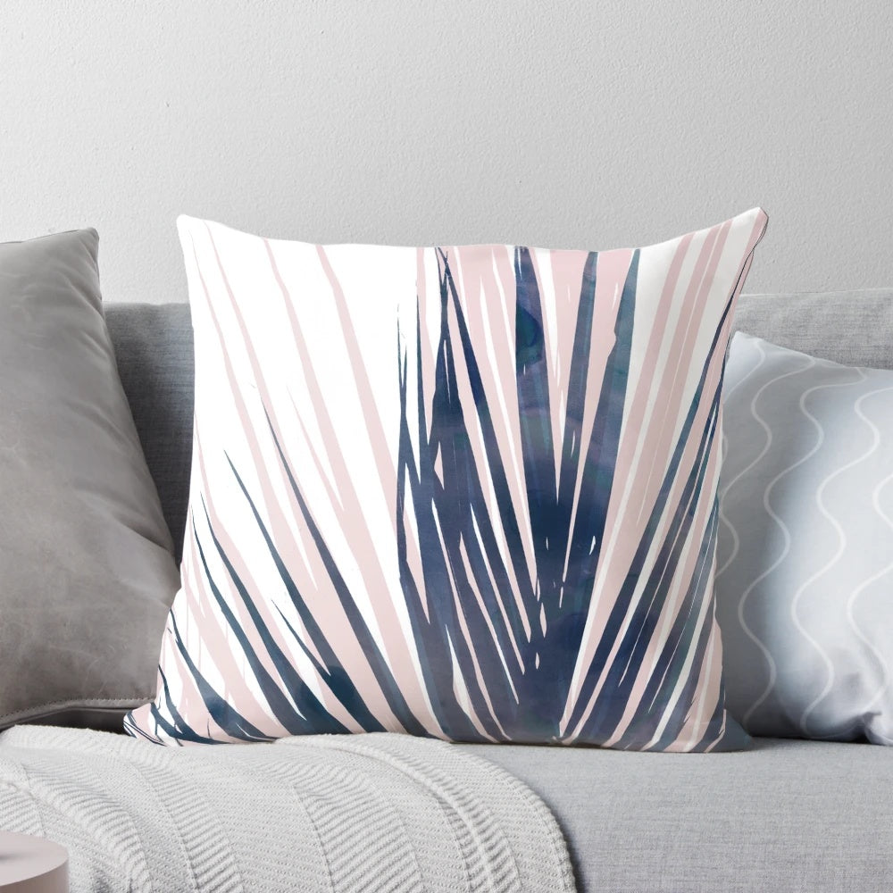 Contemporary palm leaf design pillow in navy blue and blush pink colors