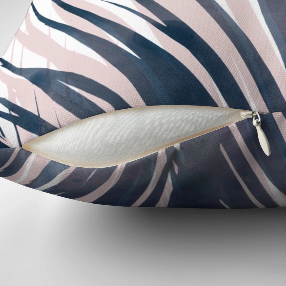 Contemporary palm leaf design pillow in navy blue and blush pink colors