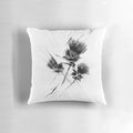 A contemporary black and white pillow featuring a stylized Scottish thistle design, creating a modern and minimalist look.