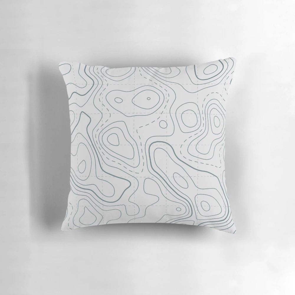 Contour lines topography map design printed on a soft white and grey pillow