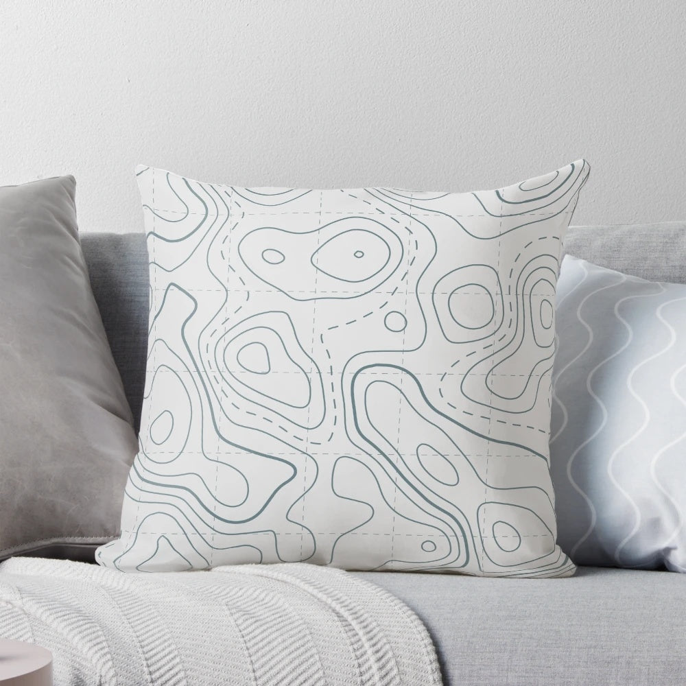 Contour lines topography map design printed on a soft white and grey pillow