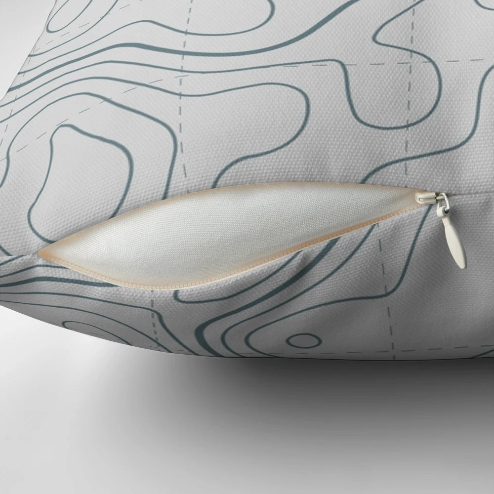 Contour lines topography map design printed on a soft white and grey pillow