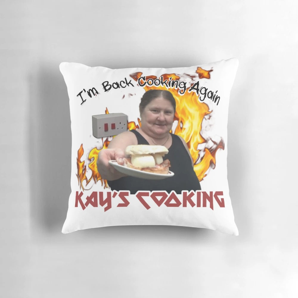 Cooking-themed throw pillow featuring "I'm Back Cooking Again" text