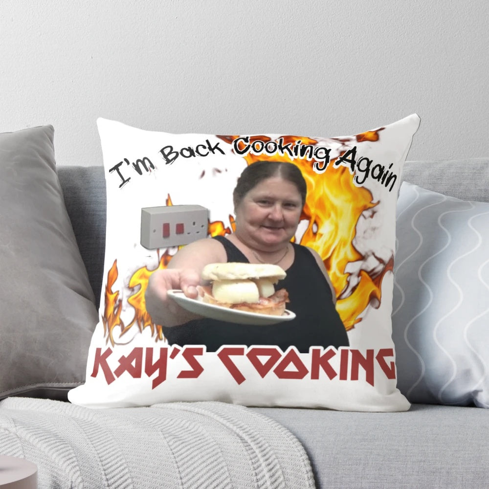 Cooking-themed throw pillow featuring "I'm Back Cooking Again" text