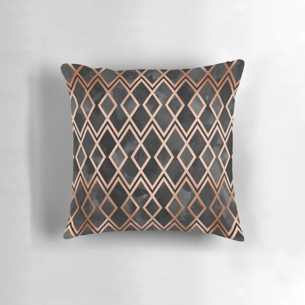 Copper and black pillow with a geometric diamond pattern