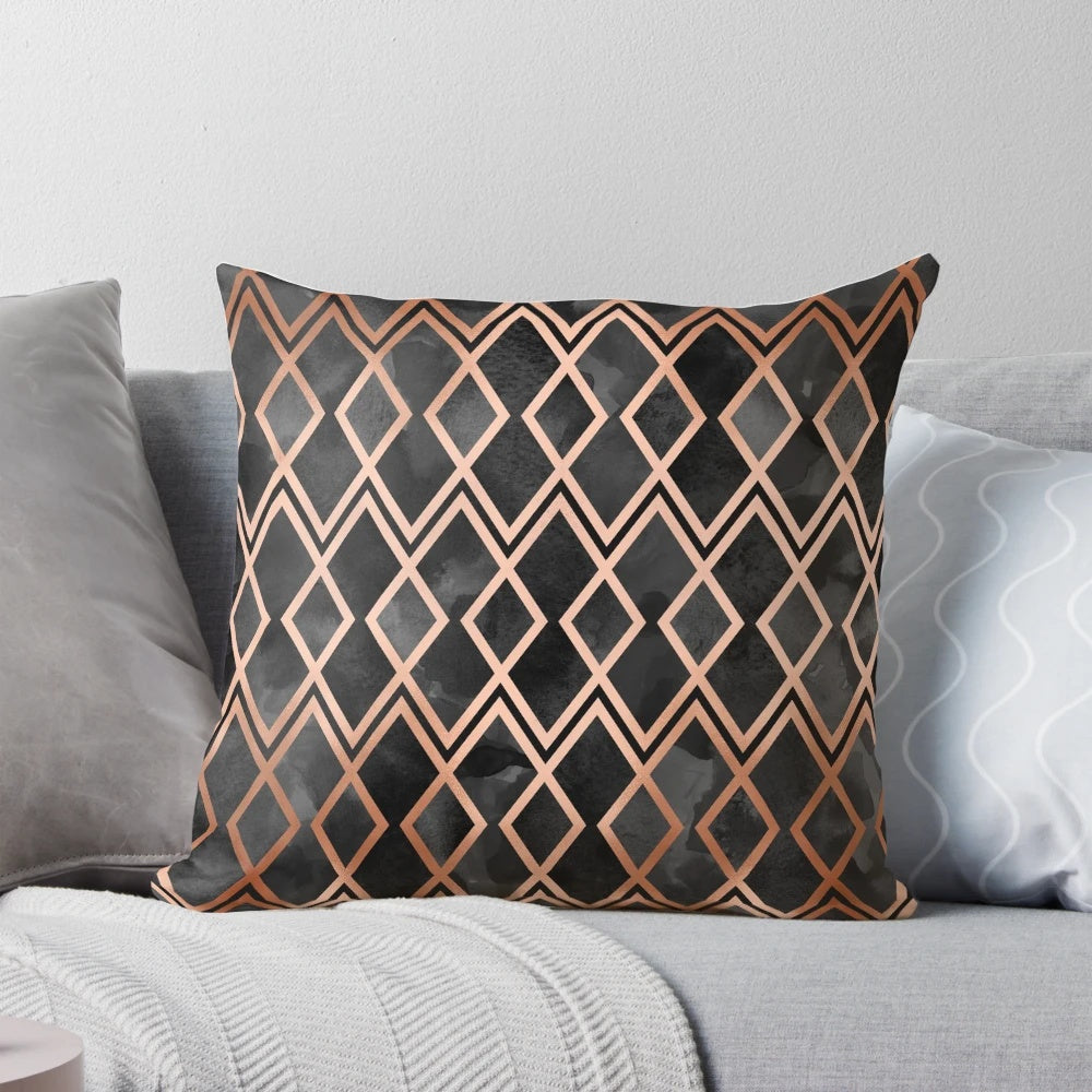Copper and black pillow with a geometric diamond pattern