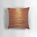 A copper-toned pillow with a serene seascape design, perfect for adding a touch of nature-inspired style to your home.