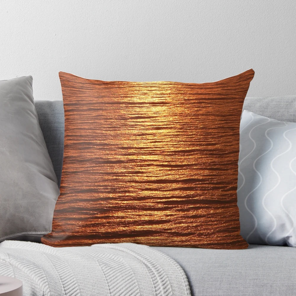 A copper-toned pillow with a serene seascape design, perfect for adding a touch of nature-inspired style to your home.