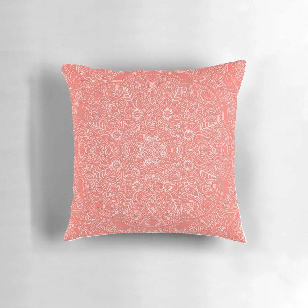 Coral and leaf mandala pattern printed on a plush, decorative pillow