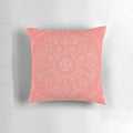Coral and leaf mandala pattern printed on a plush, decorative pillow