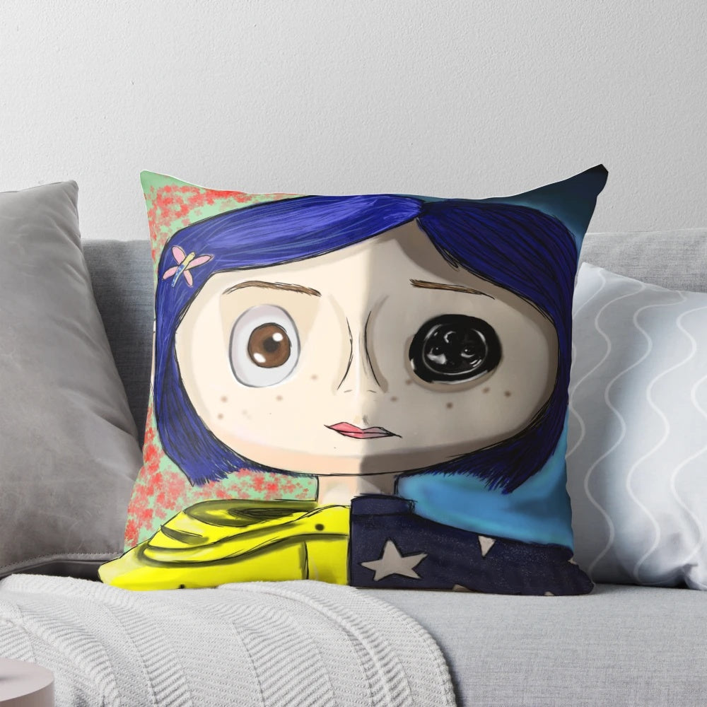Coraline-inspired decorative pillow with blue and yellow colors, floral patterns, and paranormal elements