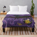 Coraline-inspired plush blanket with whimsical swirls and black cat design