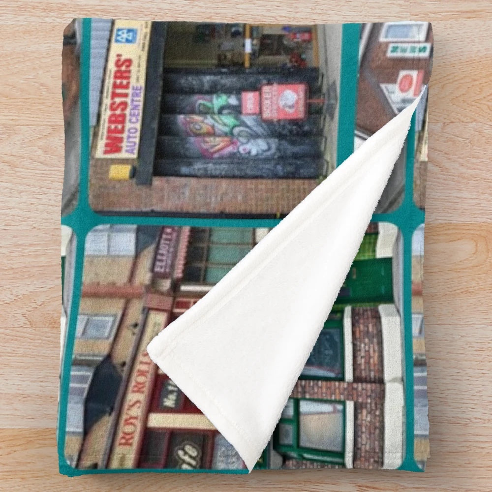 Corrie iconic buildings plush blanket featuring Coronation Street landmarks