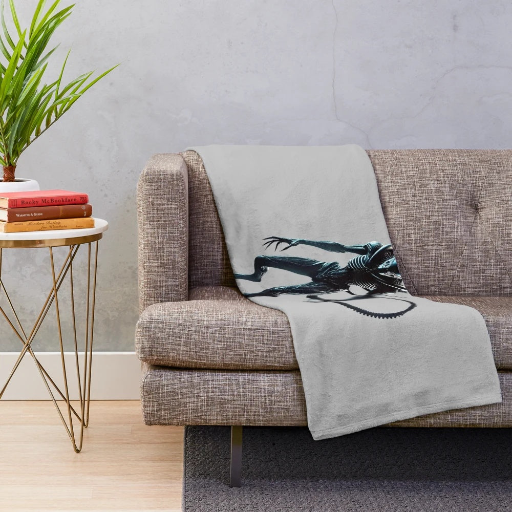 Alien-inspired plush blanket with space-themed design