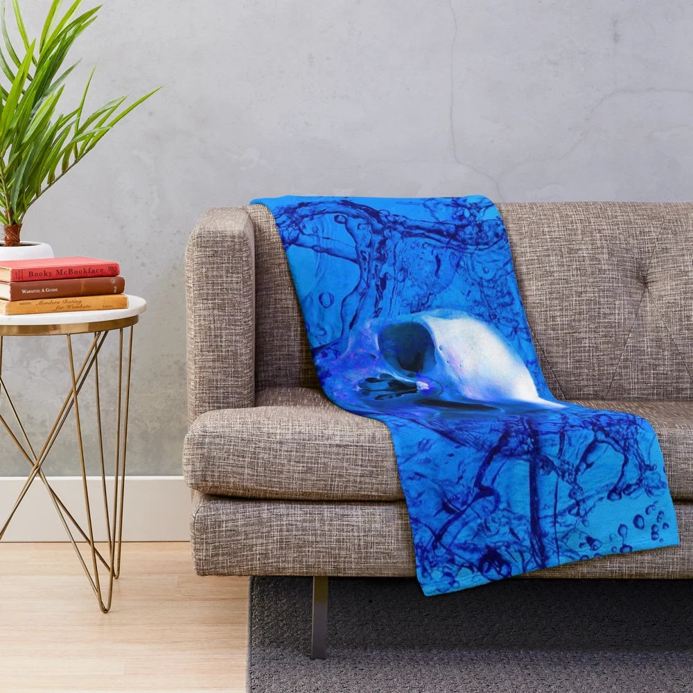 Alien skull plush blanket in vibrant blue and purple hues