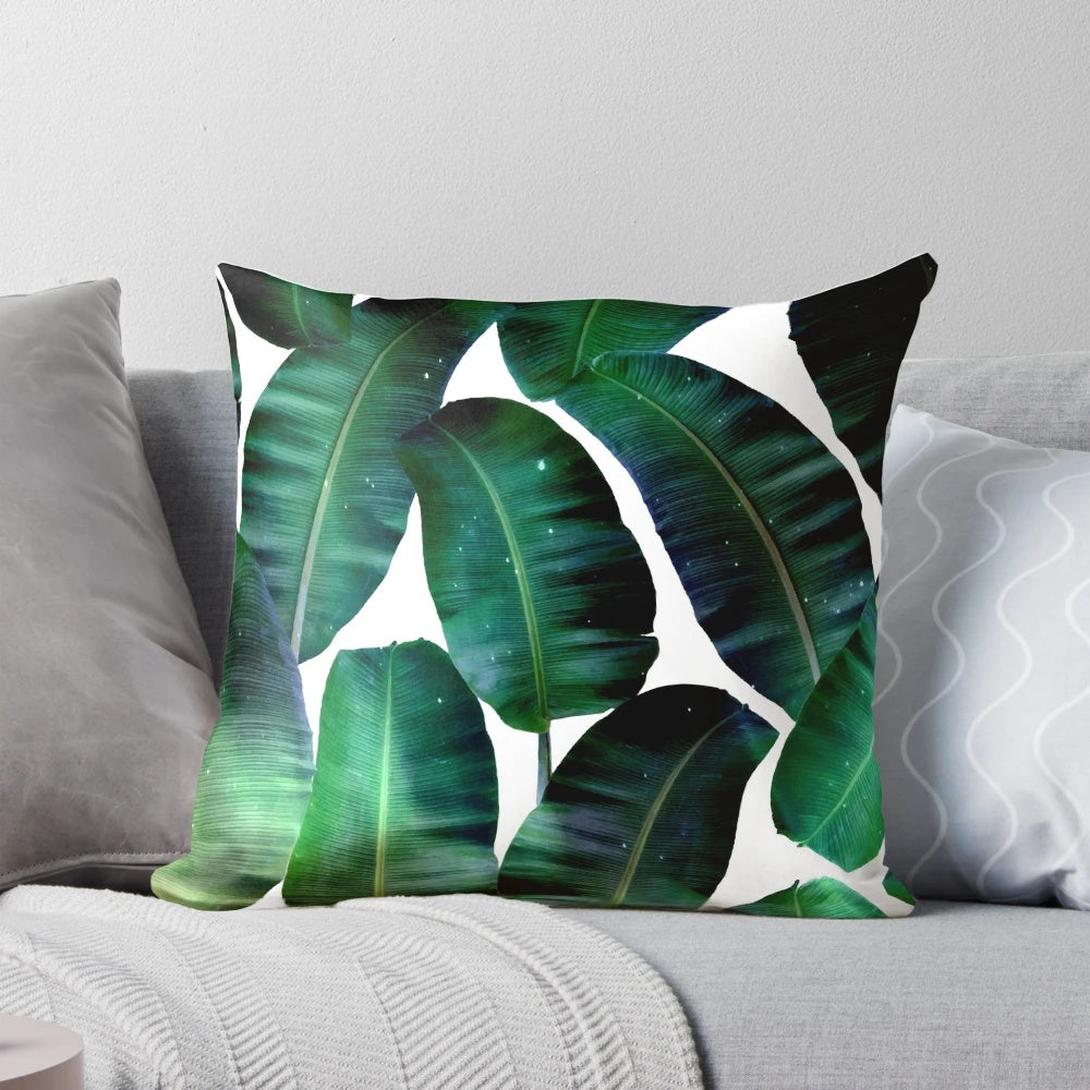 Cosmic Banana Leaves Pillow with a tropical space galaxy design