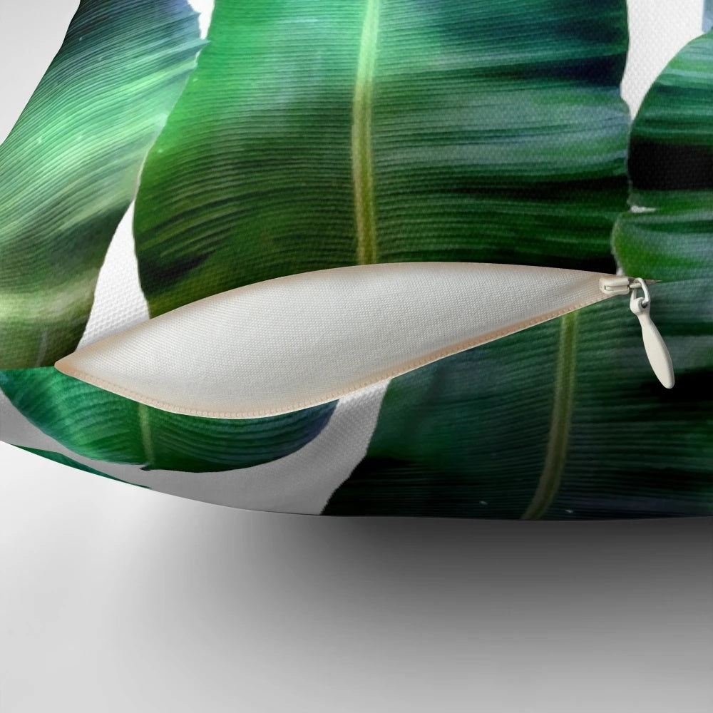 Cosmic Banana Leaves Pillow with a tropical space galaxy design