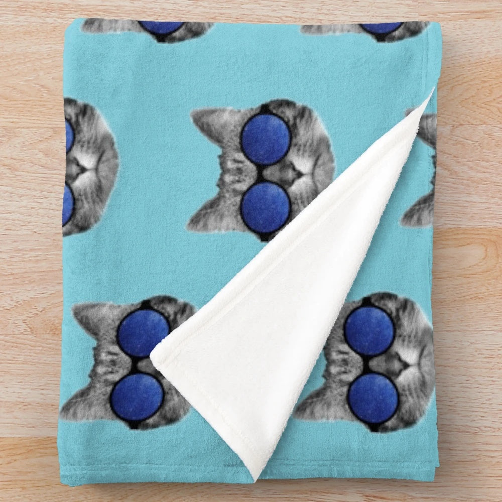 Cute space cat wearing sunglasses on a colorful galaxy plush blanket