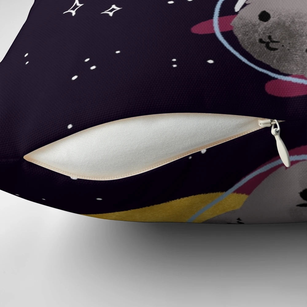 Colorful digital illustration of whimsical space cats floating among stars on a soft, plush pillow