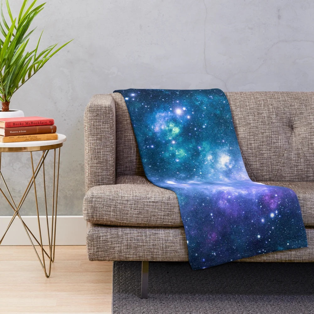 Turquoise, teal, and purple galaxy nebula print plush blanket