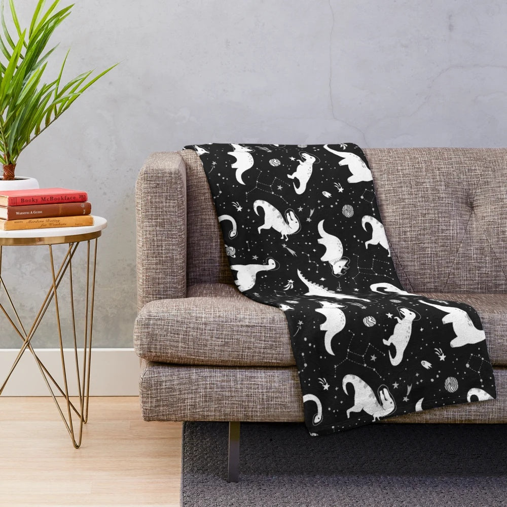 Space Dinosaurs Plush Blanket featuring a galaxy, planets, and cosmic elements